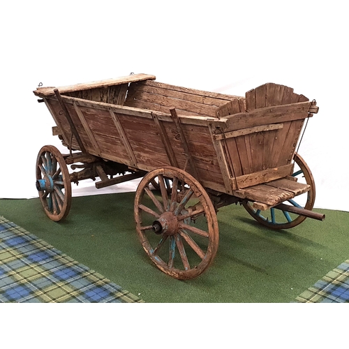 293 - VINTAGE ELM AND OAK UTILITY HORSE CART
with four wood and iron banded wheels and a pivoting front ax... 