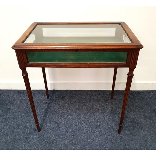 MAHOGANY BIJOUTERIE TABLE
with bevelled glass panels and standing on turned tapering supports, 75cm x 71.5cm x 48cm