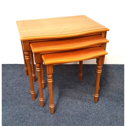 474 - LIGHT OAK NEST OF TABLES
each with a bow front and standing on turned supports, the largest 47cm x 5... 