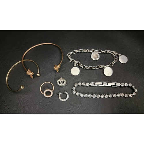 SELECTION OF FASHION JEWELLERY
comprising an Olivia Burton bee cuff bracelet, a Thomas Sabo Member Charm Bracelet with three personalised charms, a Pandora Sparkling Halo ring, a Swarovski Emily bracelet, a single Swarovski Dextera hoop earring and a Pandora Crown & Interwined Hearts charm
