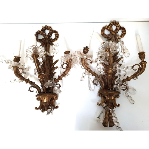 477 - PAIR OF GILT METAL THREE BRANCH WALL SCONCES
with bows and corn decoration, the shaped arms with gla... 