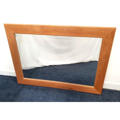 431 - PALE TEAK RECTANGULAR WALL MIRROR
with a plain plate, 77.5cm x 107.5cm