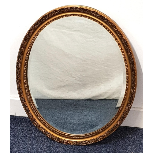 451 - OVAL WALL MIRROR
in a gilt frame with a bevelled plate, 57cm x 47cm