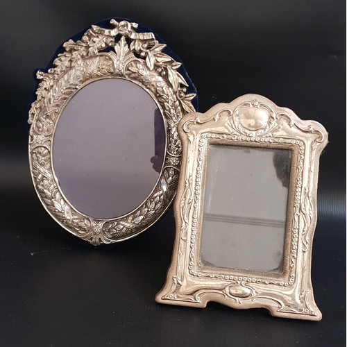 168 - TWO SILVER PHOTOGRAPH FRAMES
both with ornate frames, the oval example London 1988 by M & LS, 25.5cm... 