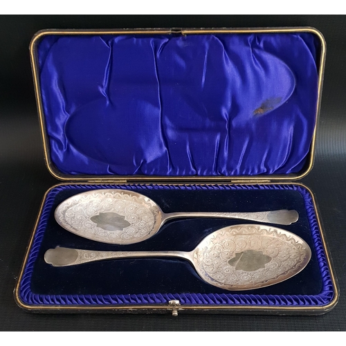 PAIR OF CASED SILVER VICTORIAN SERVING SPOONS
the bowls decorated with swirl motifs, Sheffield 1897 by Allen & Darwin, 186g/6.56oz