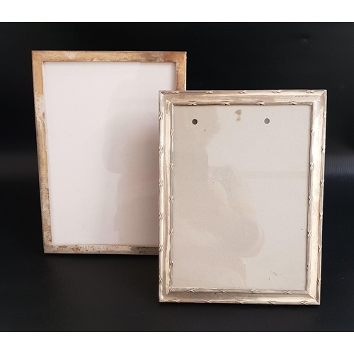 TWO GEORGE V SILVER PHOTOGRAPH FRAMES
both of plain rectangular form with easel supports, Birmingham 1915 by H.Matthews, 24cm x 18.5cm; and Birmingham 1923 by Sanders & Mackenzie, 25.5cm x 18.5cm (2)