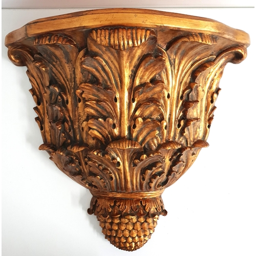 264 - LARGE GILT WALL BRACKET
of shaped outline supported by oak leaves and a pineapple finial, 54.5cm hig... 