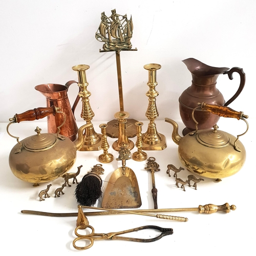 299 - MIXED LOT OF METAL WARE
including two copper ewers, two brass toddy kettles, two pairs of brass cand... 