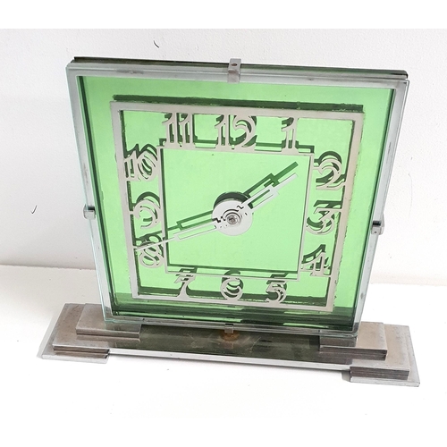 333 - ART DECO EMERALD GREEN MANTLE CLOCK
with a stepped chrome bas and green glass square dial with chrom... 