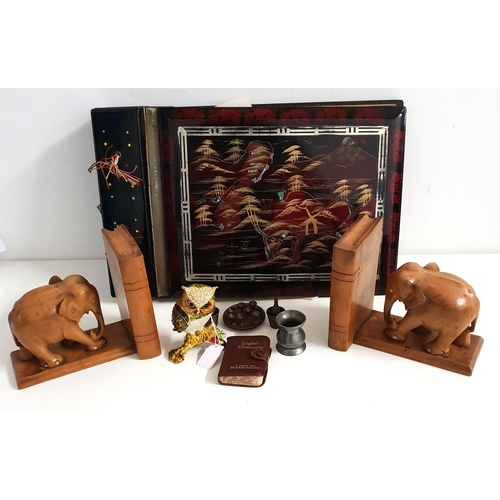 SELECTION OF COLLECTABLES
comprising a lacquered photograph album with musical cover and containing a small number of vintage photographs; a pair of carved wooden elephant bookends (with secret compartments); an enamelled and gilt owl trinket box; a pewter 1/4 gill; miniature brass items - bottles with ice buckets, trays and glasses, etc.
