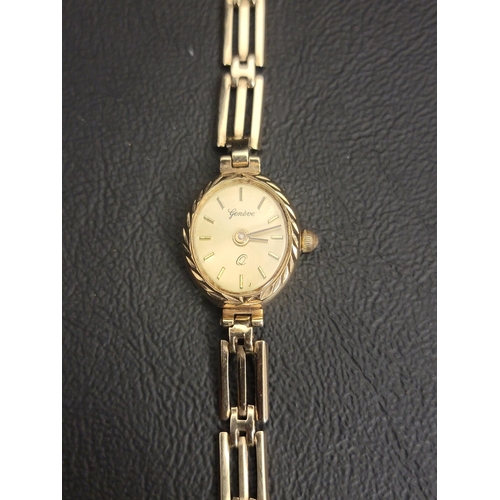 81 - NINE CARAT GOLD LADIES GENEVE WRISTWATCH
the oval gold dial with baton five minute markers, on a nin... 