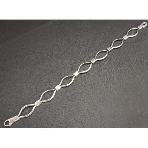 NINE CARAT WHITE GOLD BRACELET 
the fancy link chain bracelet with oval trigger clasp, approximately 8.2 grams and 19cm long