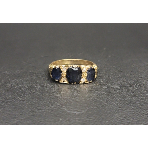SAPPHIRE AND DIAMOND RING
the three graduated oval cut sapphires separated by small diamonds, the largest sapphire approximately 0.85cts, on eighteen carat gold shank, ring size K and approximately 5.1 grams