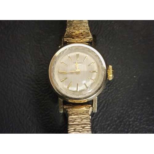LADIES VINTAGE GOLD PLATED LONGINES WRISTWATCH
the champagne dial with gold baton five minute markers, with a faceted edge to the face, on a flexi bracelet strap