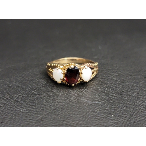 26 - GARNET AND OPAL THREE STONE RING
the central oval cut garnet approximately 0.75cts flanked by an ova... 