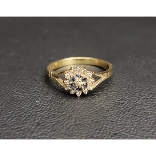 53 - DIAMOND AND SAPPHIRE CLUSTER RING
the central diamond in sapphire and outer diamond surround, on eig... 