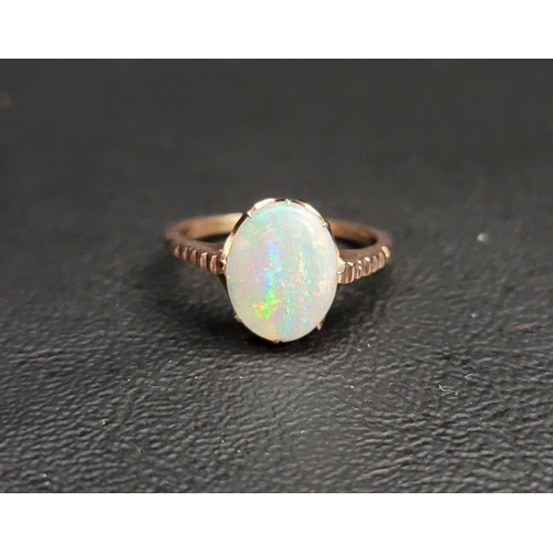 OPAL SINGLE STONE RING
the oval cabochon opal measuring approximately 11.2mm x 8.8mm, on unmarked gold shank, ring size K and approximately 2.2 grams