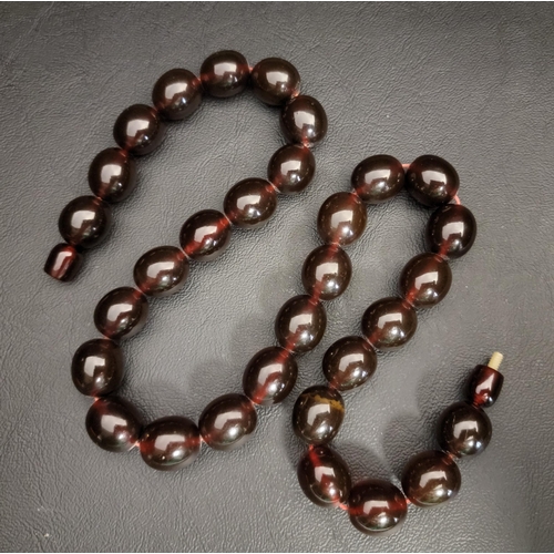 76 - AMBER BEAD NECKLACE
each of the beads approximately 1.4cm long, total weight approximately 60.3 gram... 