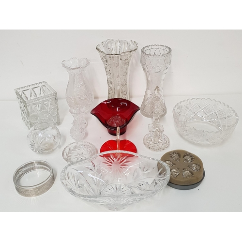 SELECTION OF CRYSTAL AND GLASSWARE
including vases, centre bowls, scent bottle with stopper, a set of six small candle stands, and a red frilly rimmed bowl