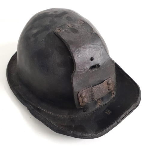 20th CENTURY CHILDS LEATHER MINERS HELMET
with impressed '56' to the brim and leather flap for lamp fixture