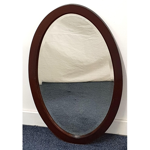 MAHOGANY OVAL WALL MIRROR
with a bevelled plate, 77cm x 49.5cm