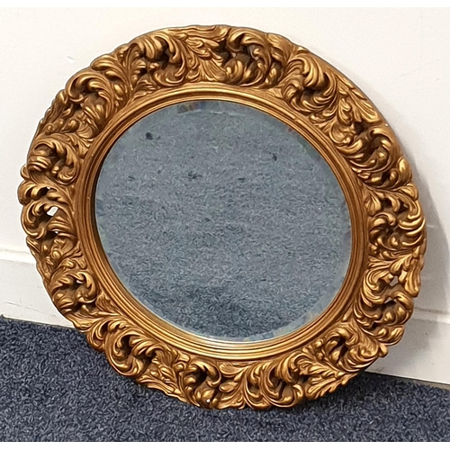 CIRCULAR WALL MIRROR
in a gilt frame with a bevelled plate, 45.5cm diameter