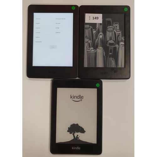 149 - THREE AMAZON KINDLE PAPERWHITE E-READERS
comprising a Paperwhite 4 serial number G000 PP12 9186 0F3S... 