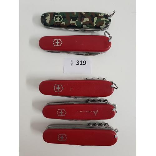FIVE VICTORINOX SWISS ARMY KNIVES
of various sizes and designs
Note: You must be over the age of 18 to bid on this lot.