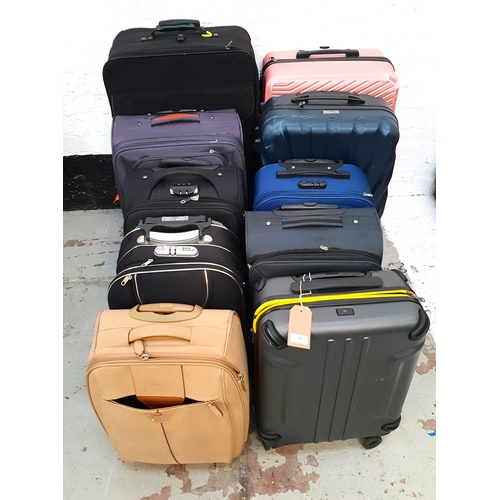 64 - SELECTION OF TEN SUITCASES 
including MK Luggage, American Tourister, Antler, and Ariana,  etc.
Note... 