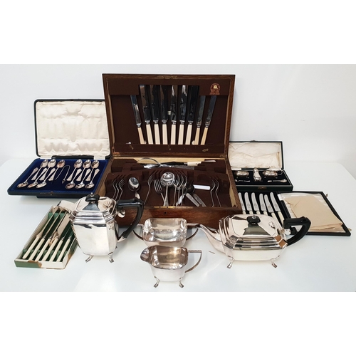 MIXED LOT OF SILVER PLATE
comprising an oak part canteen of cutlery, twelve tea spoons and a pair of cased sugar tongs, part cased set of fish knives and forks with ivorine handles, cased set of six side knives with ivorine handles, boxed set of six table knives, cased Wilson & Sharp of Edinburgh cruet set, and a tea set with a tea pot, hot water jug, milk jug and twin handled sugar bowl
