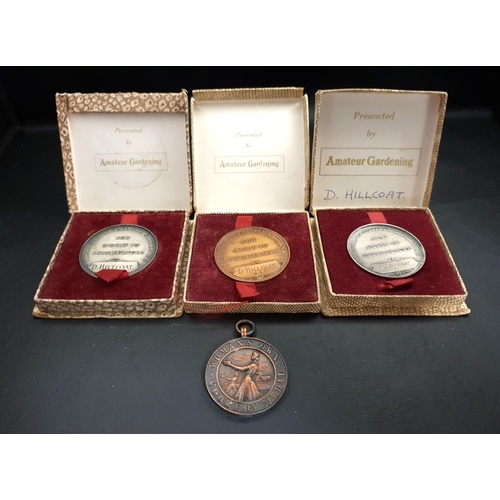 THREE BOXED GARDENING MEDALS
awarded to D.Hillcoat 'For Merit In Horticulture' and a 'Woman's Own Cookery Medal' awarded to Mrs. D. Hillcoat 1958 (4)
