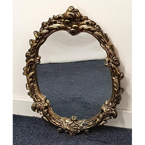 OVAL WALL MIRROR
in a shaped gilt frame with a plain plate, 61.5cm x 45cm; together with a wooden framed example (2)