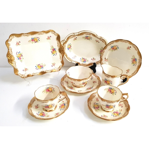 ROYAL ALBERT TEA SERVICE
the cream ground and flowers with gilt highlights, comprising ten cups, twelve saucers, twelve side plates, milk jug, sugar bowl, cake and sandwich plate (38)