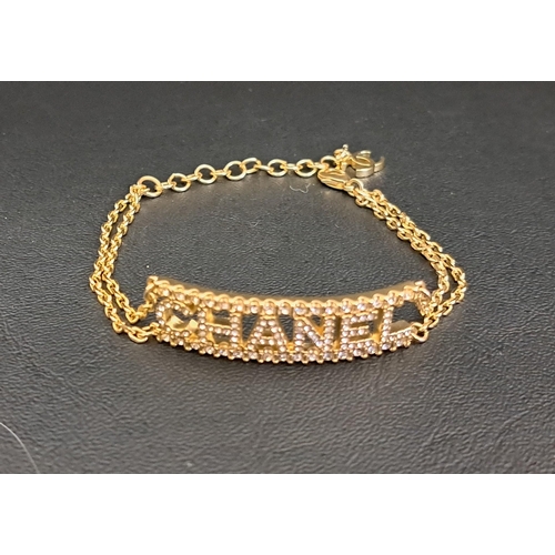 92 - CHANEL CRYSTAL SET BRACELET
the central curved 'CHANEL' panel flanked by double chain links to each ... 