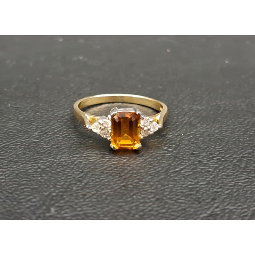 88 - CITRINE AND DIAMOND DRESS RING
the central emerald cut citrine approximately 0.9cts flanked by three... 