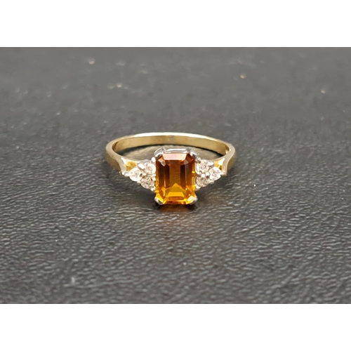 88 - CITRINE AND DIAMOND DRESS RING
the central emerald cut citrine approximately 0.9cts flanked by three... 