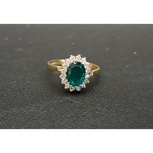 104 - EMERALD TRIPLET AND DIAMOND CLUSTER RING
the central triplet approximately 8mm x 6mm, in sixteen dia... 