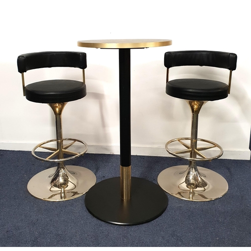 325 - BLACK ASH EFFECT HIGH BISTRO TABLE AND TWO SWIVEL BAR STOOLS
the table with a circular top and brass... 