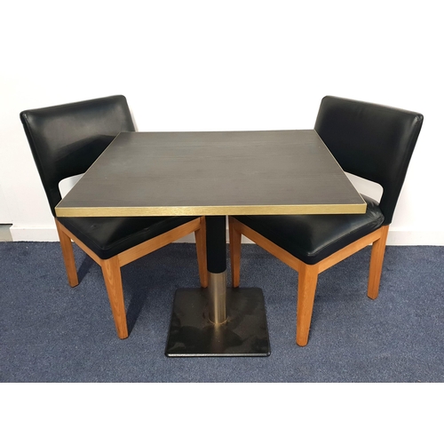 BLACK ASH EFFECT TABLE AND TWO CHAIRS
the table with a rectangular top and brass effect edge on turned metal column with brass collar and black metal weighted base, 71cm high, the top 80cm x 70cm; the chairs with vinyl padded backs and seats