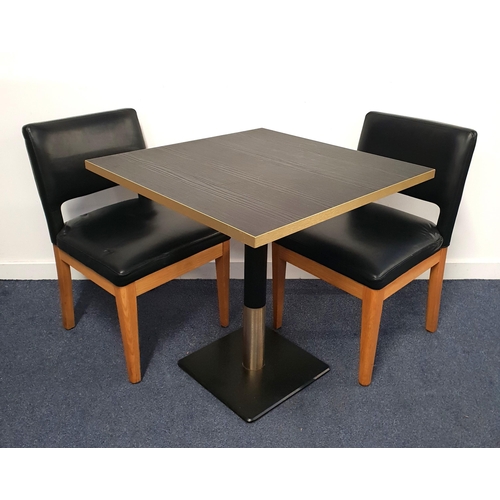 336 - BLACK ASH EFFECT TABLE AND TWO CHAIRS
the table with a square top and brass effect edge on turned me... 