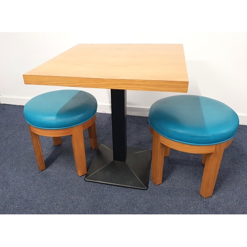 ASH EFFECT TABLE AND TWO STOOLS
the table with a square top on a plain metal column with black metal weighted base, 75cm high, the top 70cm x 70cm; the stools with circular turquoise padded seats
