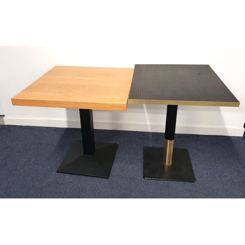 TWO ASH EFFECT TABLES
one in black ash effect with rectangular circular top and brass effect edge on turned metal column with brass collar and black metal weighted base, 76cm high, the top 70cm x 60cm; the other ash effect table with black metal column and weighted base, 72cm high and the top 70cm x 70cm
