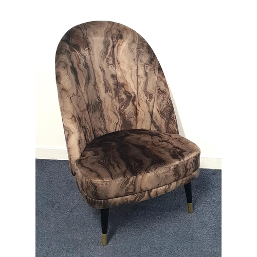 SHAPED BACK PADDED CHAIR
with deep cushion seat, covered in marble effect fabric, standing on tapering supports with brass caps