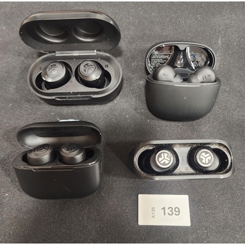 139 - FOUR PAIRS OF EARBUDS IN CHARGING CASES
comprising Philips, Jlab