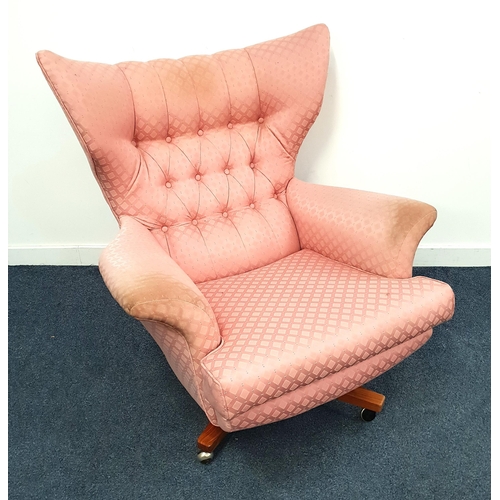 262 - 1950s WING BACK ARMCHAIR
with a button back on a rotating base with casters