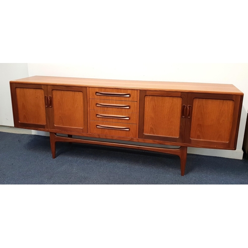 355 - G PLAN TEAK SIDEBOARD
with four central drawers flanked by two pairs of panelled cupboard doors, sta... 