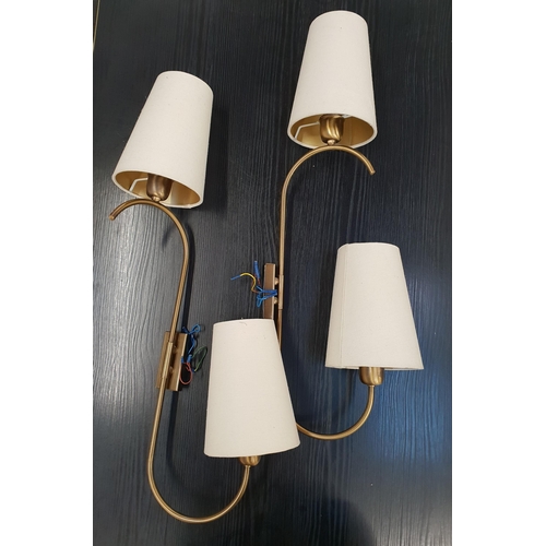 364 - TWO PAIRS OF BRASS WALL LIGHTS
each with rotating shaped arm with conical cream hessian shades, 74cm... 