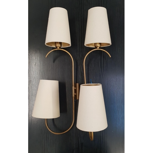 366 - TWO PAIRS OF BRASS WALL LIGHTS
each with rotating shaped arm with conical cream hessian shades, 74cm... 