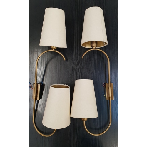 367 - TWO PAIRS OF BRASS WALL LIGHTS
each with rotating shaped arm with conical cream hessian shades, 74cm... 