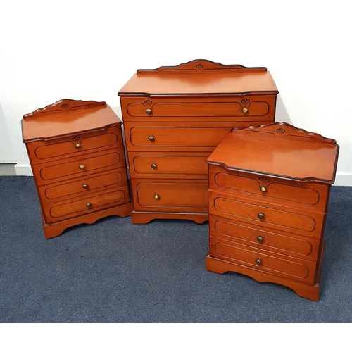 CHERRY VENEER CHEST OF DRAWERS
with a shaped raised back above four graduated drawers with carved panels, 92.5cm x 82cm x 42.5cm, together with a pair of matching bedside cherry veneer chests with shaped raised backs above four drawers with carved panels, 73cm x 53cm x 38cm (3)